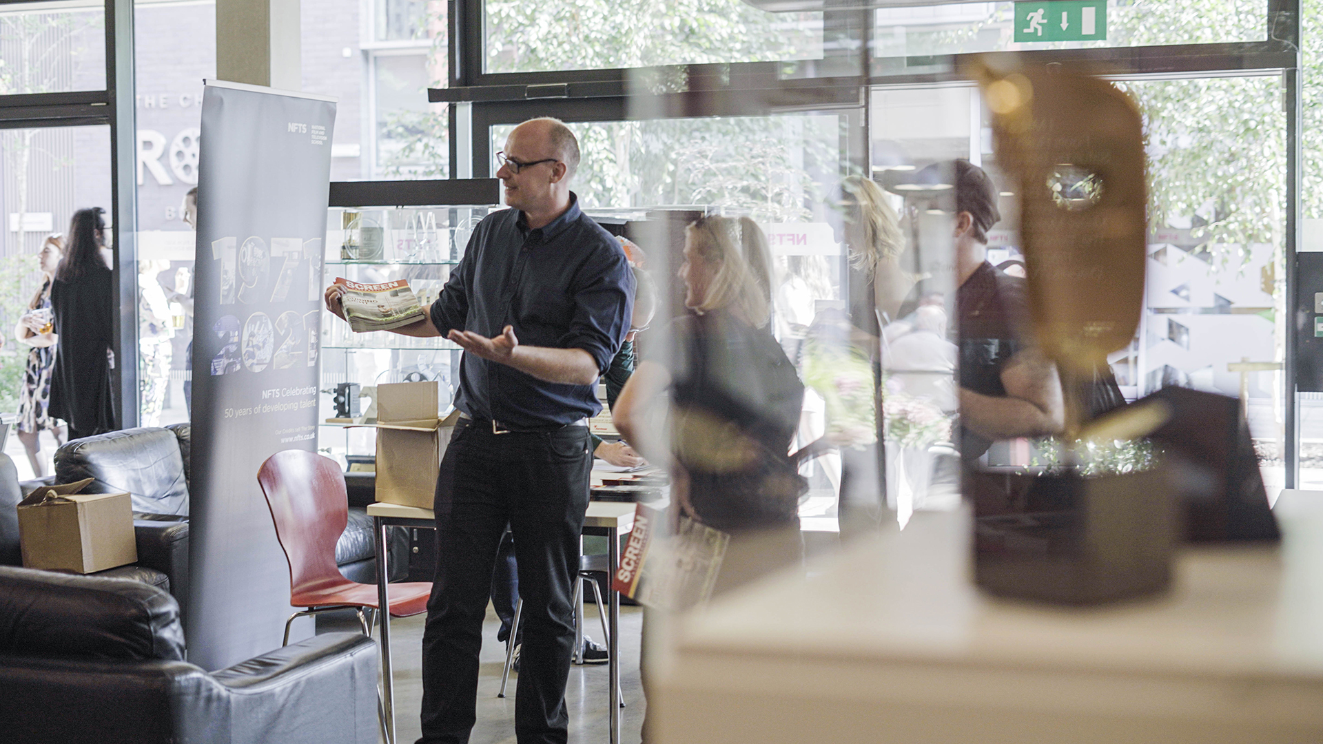 NFTS Director talking to alumnus in reception area