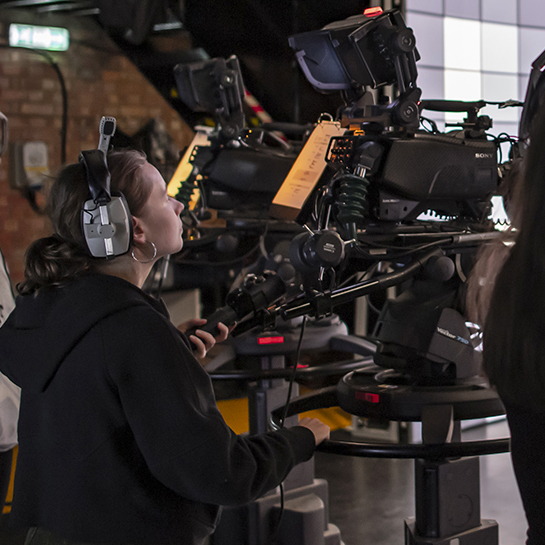 Alexandra Calver working behind the camera on set