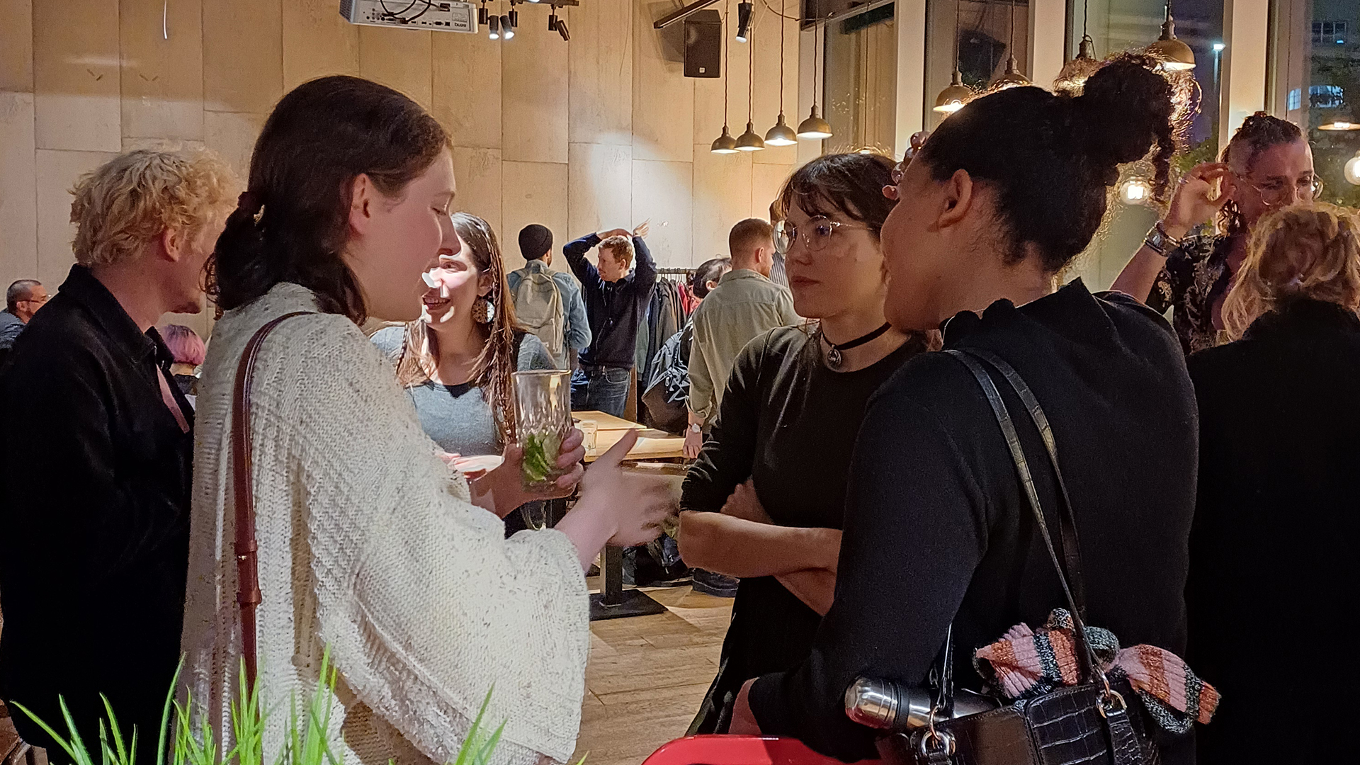 People chatting with drinks