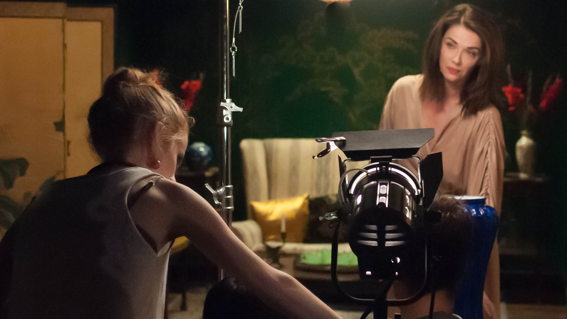 Student filming commercial on set