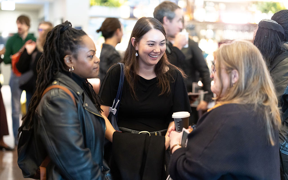 People chatting at event