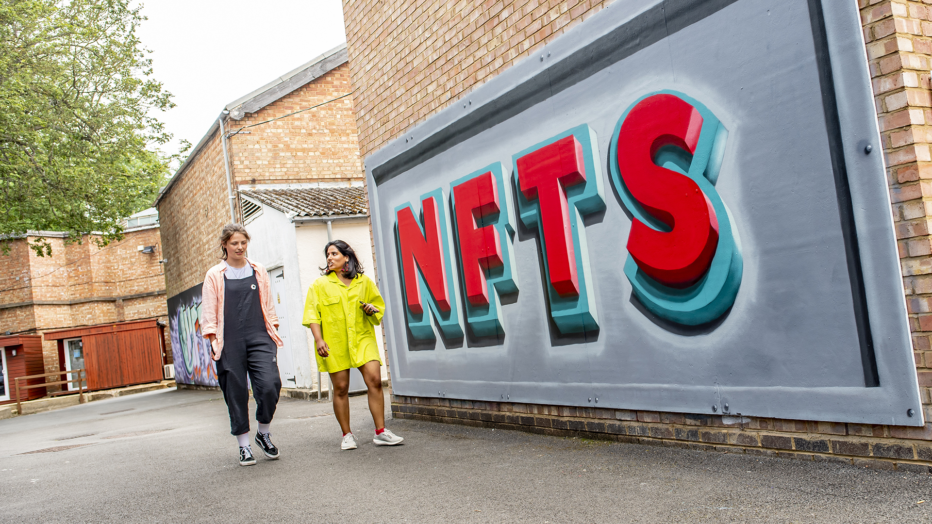 students talking while walking on site