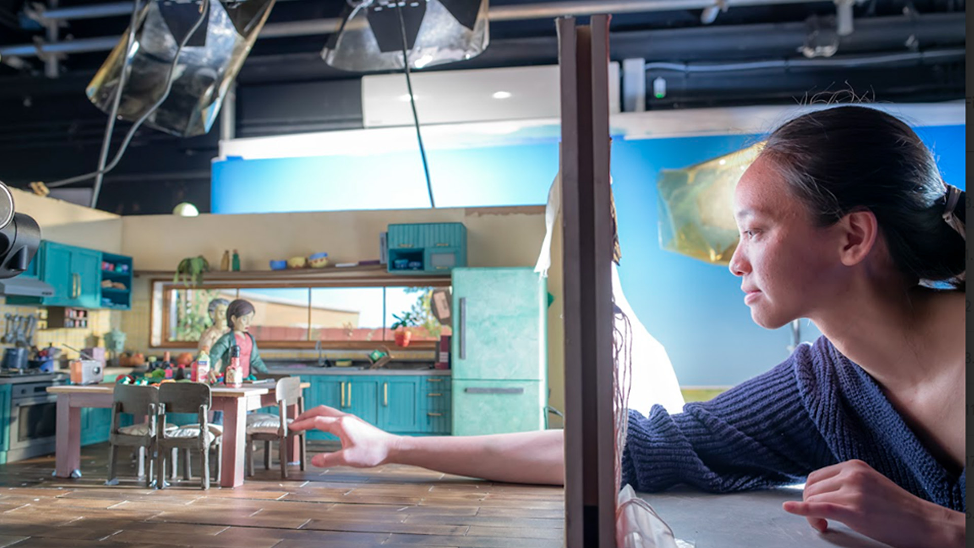 Woman animating models on set
