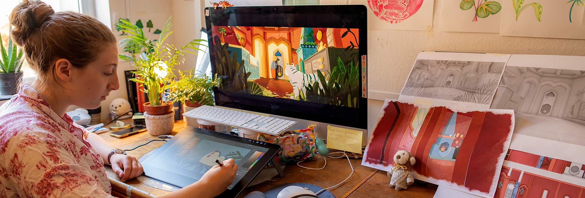 student drawing on digital tablet